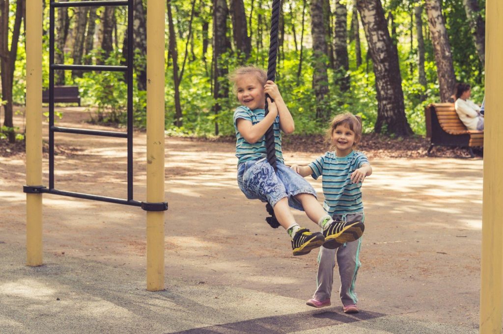 Children playing outdoors at a neighbourhood park in Chilliwack's master-planned community.